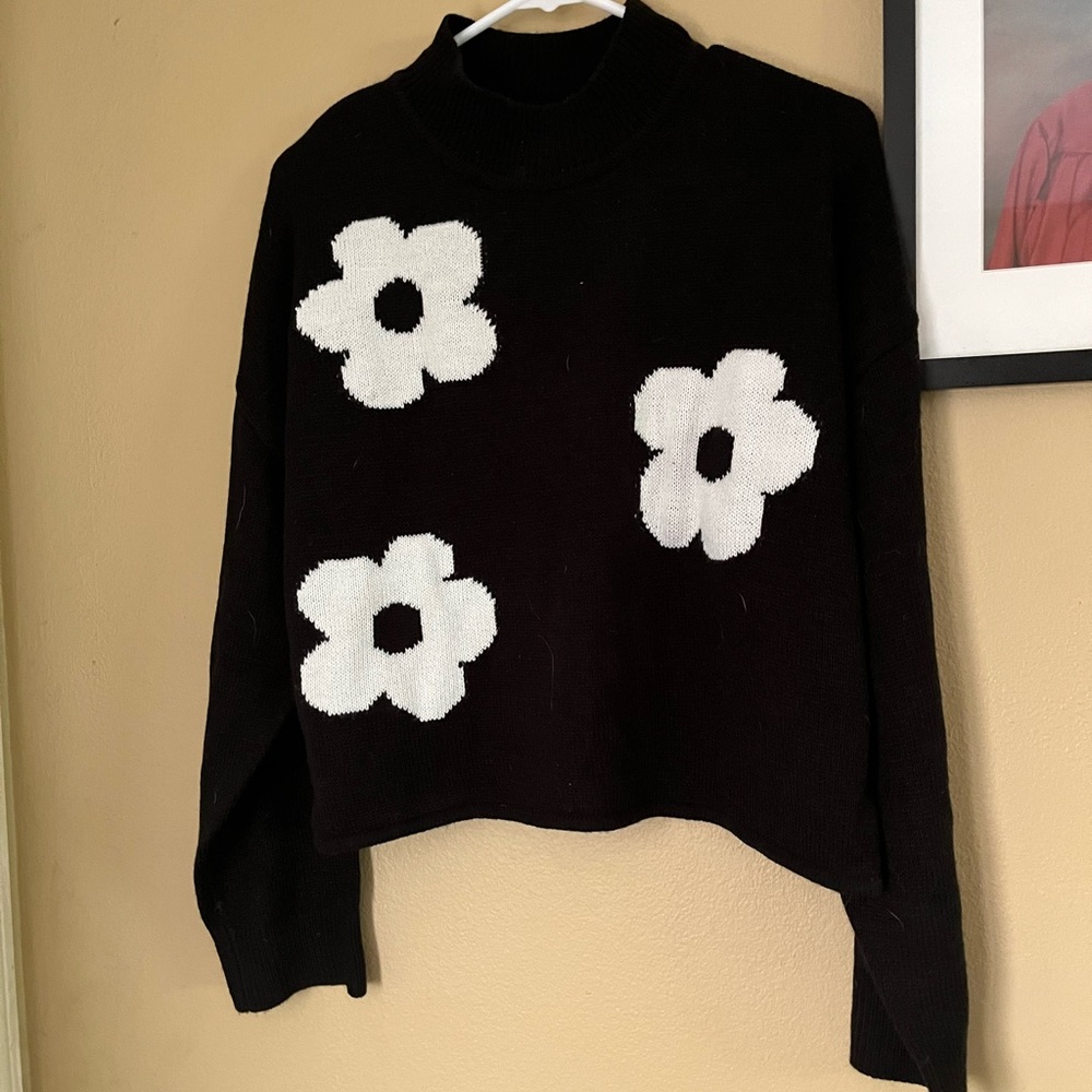 Black sweater with white flowers
